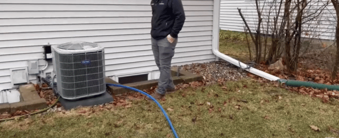 chris and sebastian of championplumbing.com setting up temporary water connection out in Apple Valley, MN